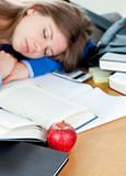 Young woman sleeping on a desk