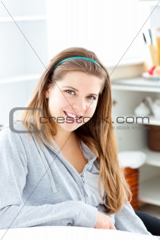 Smiling woman sitting at a table