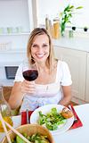 Attractive woman having an healthy dinner