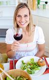 Smiling woman with a glass of wine