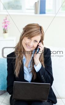 Beautiful confident businesswoman using a mobile phone