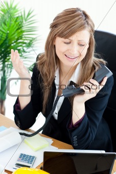 Assertive businesswoman on phone