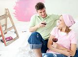 Cheerful couple drinking a glass wine