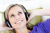 Joyful woman  listening to music in the living-room 