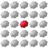 Red umbrella among white