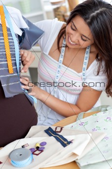 Glad young woman working in a store 
