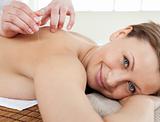 Happy woman receiving a spa treatment