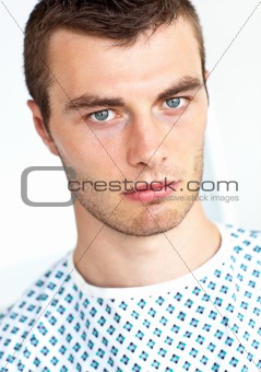 Young unhappy patient looking at camera 