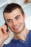 Handsome young man talking on phone 