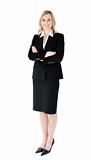 A confident businesswoman with folded arms