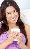 Beautiful woman holding a cup of coffee 