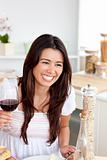 Delighted  woman drinking red wine 