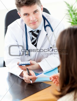 Young male doctor giving prescription to a patient