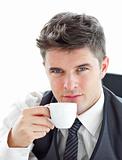 Attractive businessman drinking coffee 