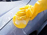 Close-up of a person washing his car