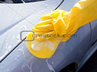 Close-up of a person washing his car