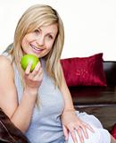 Bright woman eating an apple 