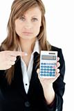 Depressed businesswoman holidng a calculator