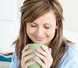 Relaxed woman enjoy her coffee
