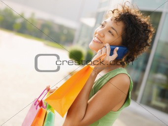 hispanic woman with shopping bags