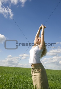 Young happy woman in field