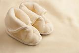 Kids slippers and part of blanket