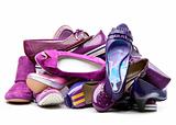 Pile of female violet shoes