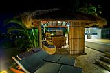 Resort style living with Bali hut with bar and deck chairs