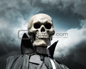 grim reaper. death's skeleton on a cloudy dramatic sky