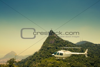 Helicopter in air in front of Corcovado Rio De Janeiro Brazil