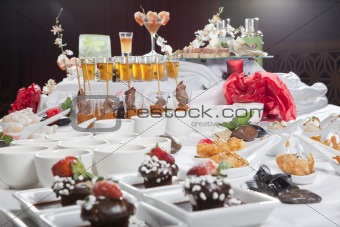 Asian Fusion appetizers and desserts on table
