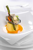 Oysters Kilpatrick served on designer plate in restaurant