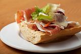 ham sandwich with salad leaves