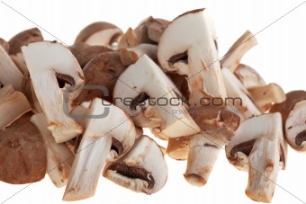 heap of chopped mushrooms on a wooden board