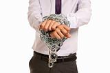 Businessman hands fettered with chain and padlock, job slave symbol, isolated on white background