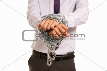 Businessman hands fettered with chain and padlock, job slave symbol, isolated on white background