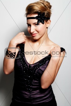 Young blond girl fashion glamour beauty shot getting off the shoulder straps