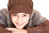 Beautiful young smiling woman with knit hat smiles happy