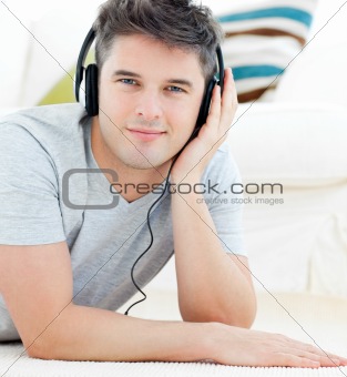 Portrait of a happy man with headphones looking at the camera