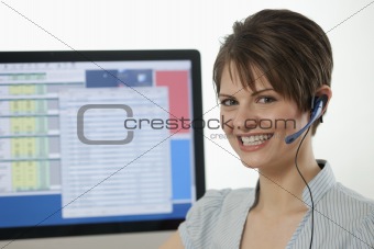 Attractive Young Businesswoman With a Headset