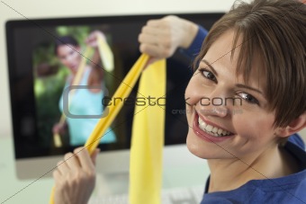 Young Woman Using Exercise Bands