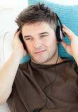 Handsome man with headphones listening to music  