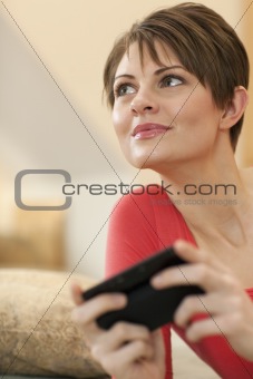 Young Woman Texting at Home