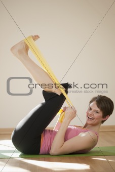 Young Woman Exercising With Resistance Bands