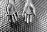 hands open futuristic robot silver steel over gray