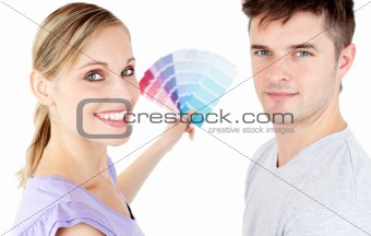 Happy couple with color samples 