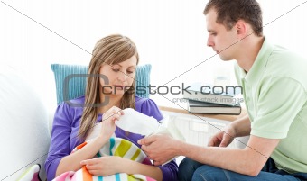 Young man with tissues and his sick girlfriend
