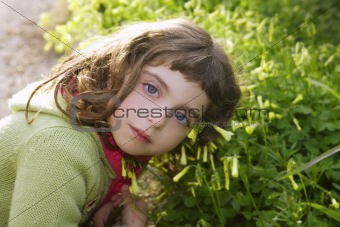 little girl hug grass happy in green meadow