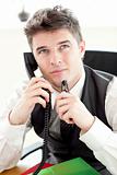 Thoughtful businessman talking on phone