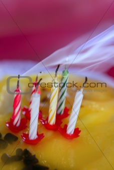 Blowed birthday cake candles with smoke